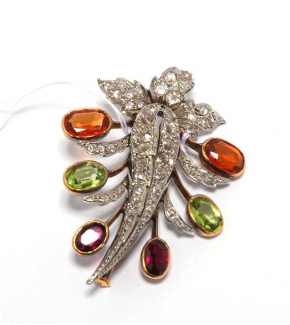 Appraisal: GARNET PERIDOT AND DIAMOND BROOCH ca Platinum and ros gold