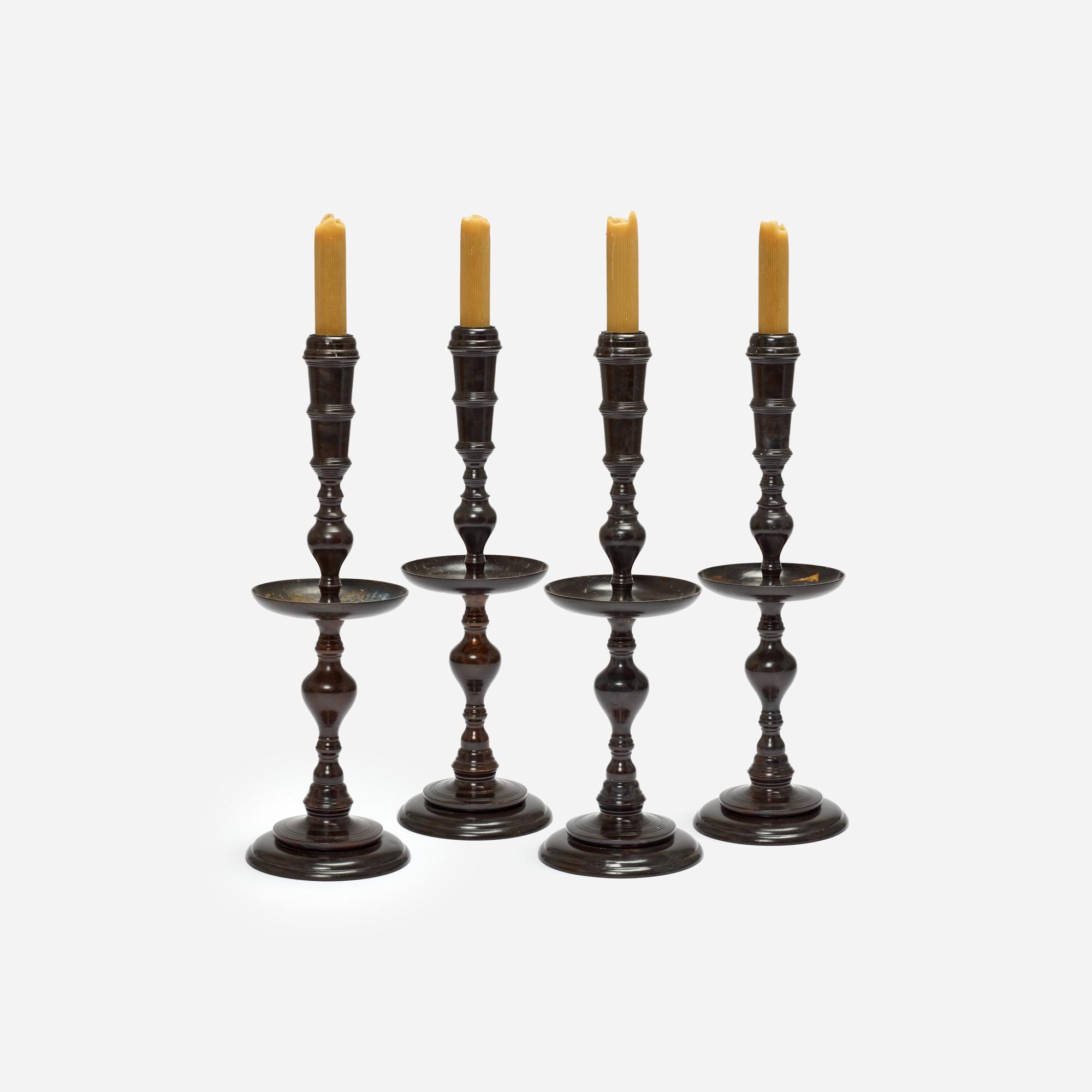 Appraisal: FOUR MAITLAND-SMITH BRONZE FLOOR CANDLE HOLDERS Four floor-standing bronze candle