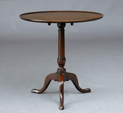 Appraisal: CHIPPENDALE MAHOGANY TILT-TOP TRIPOD TABLE The molded top on column