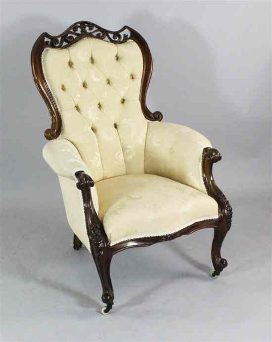 Appraisal: A Victorian carved mahogany button back salon chair with pierced