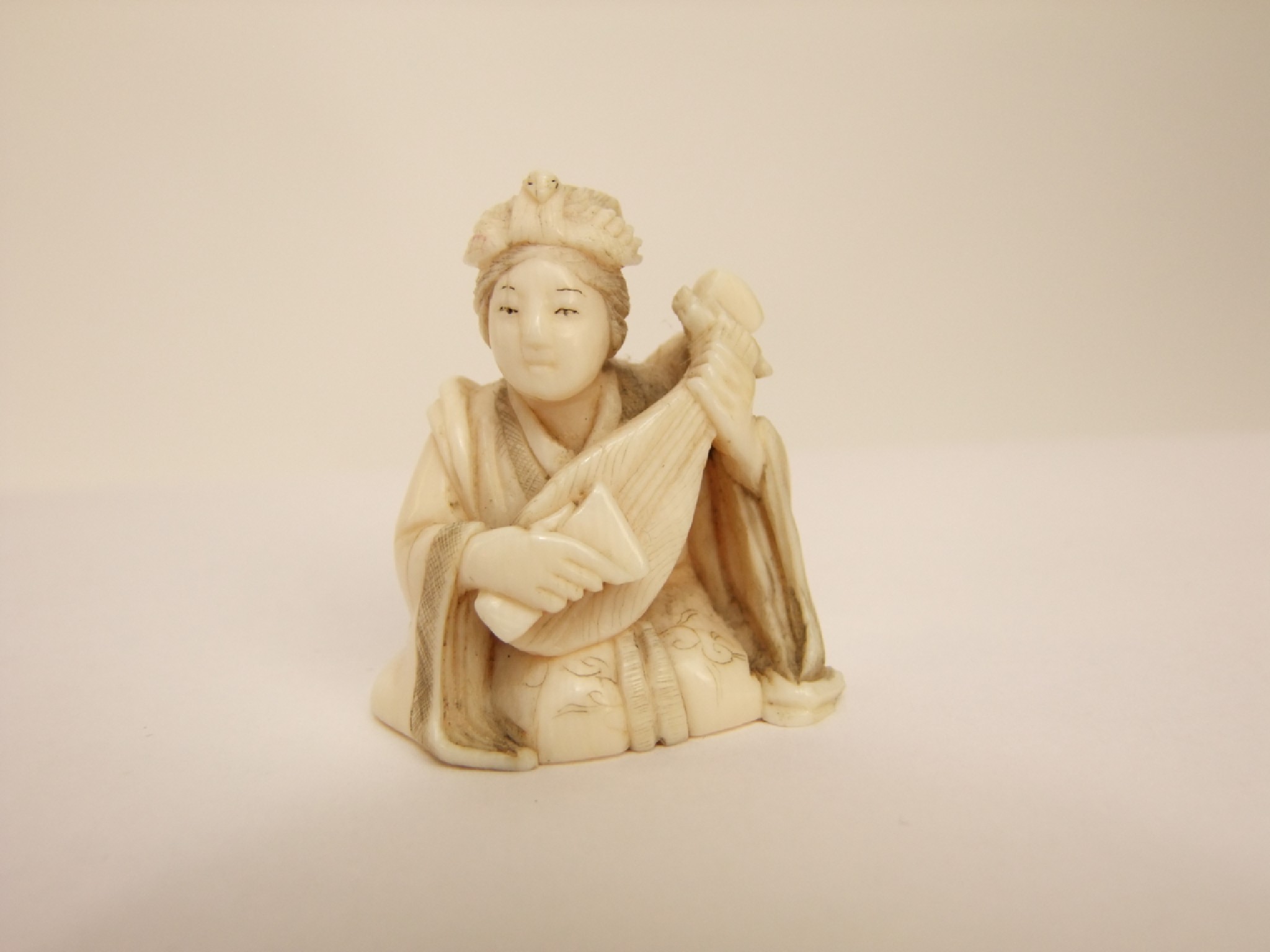 Appraisal: A late th early th century Japanese ivory figure seated