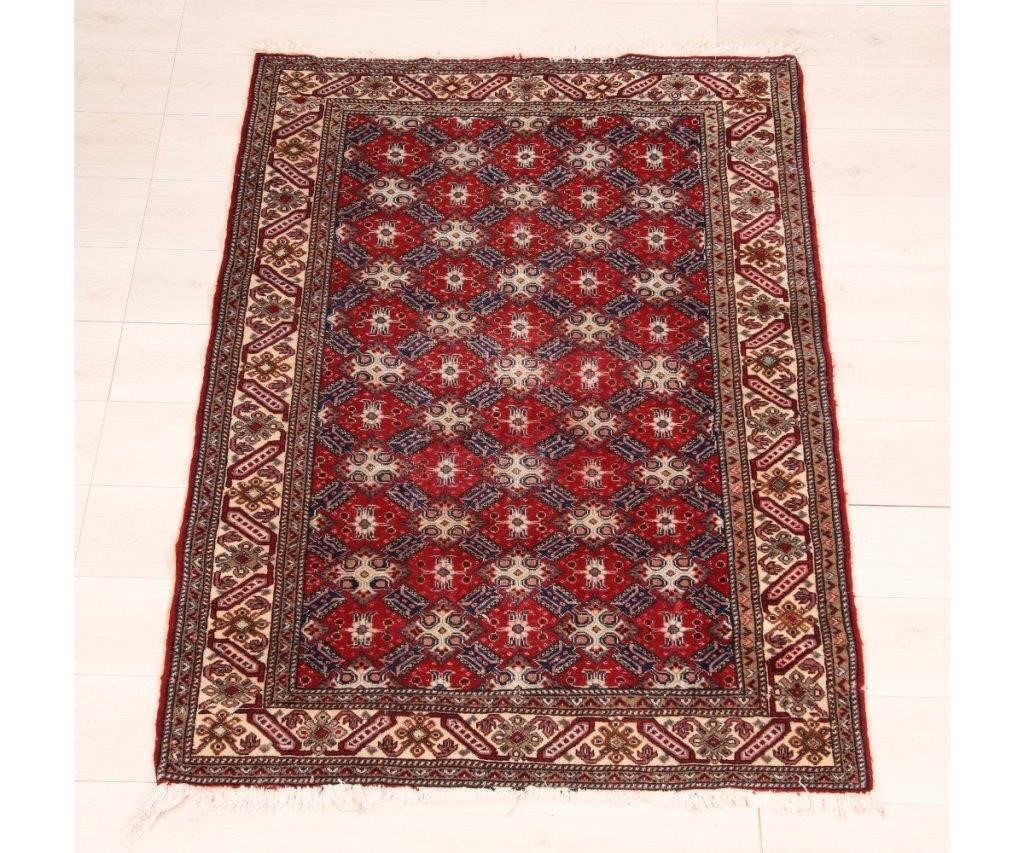 Appraisal: Qum Persian center hall carpet with an overall red field