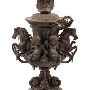 Appraisal: A Continental Cast Metal Urn with Putti and Hippocampi Late