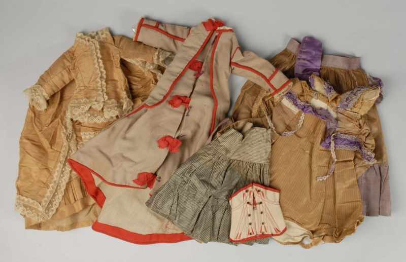 Appraisal: Box Lot of Antique Doll Clothes Description Gold silk s