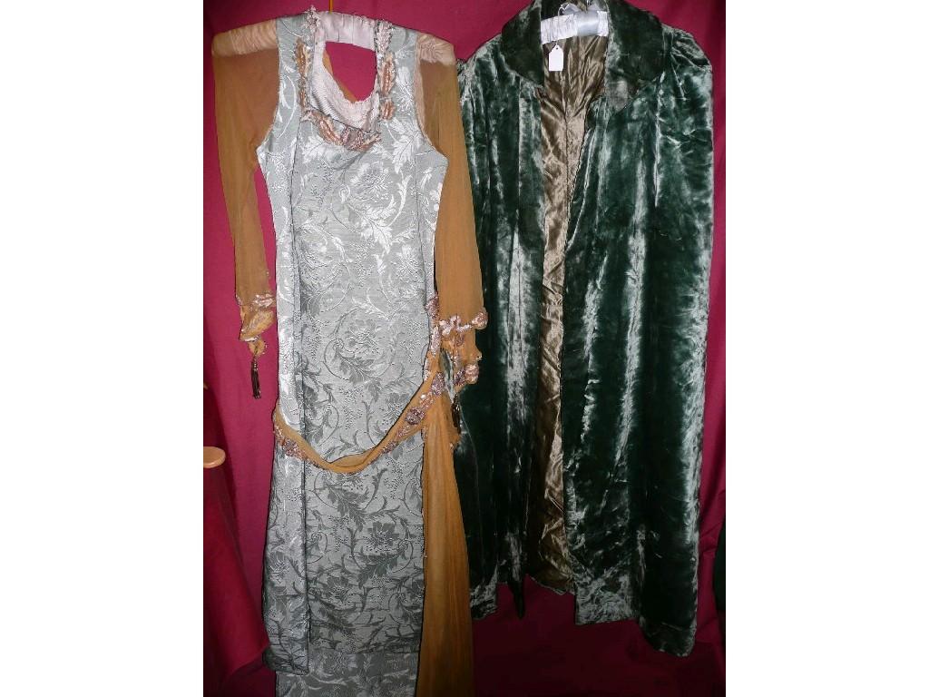 Appraisal: A vintage green velvet cloak lined a pale green brocade