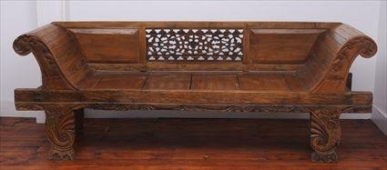 Appraisal: INDONESIAN CARVED HARDWOOD SETTEE The rectangular back with two beveled