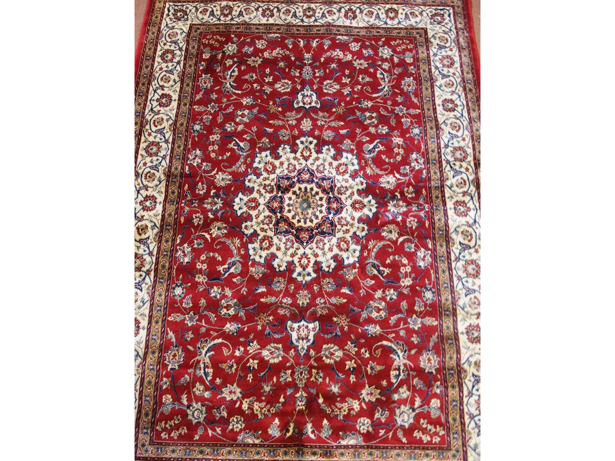 Appraisal: A Kashmir silk rugthe red ground woven with central medallion