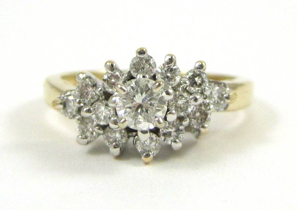 Appraisal: DIAMOND AND FOURTEEN KARAT GOLD RING with round-cut diamonds set