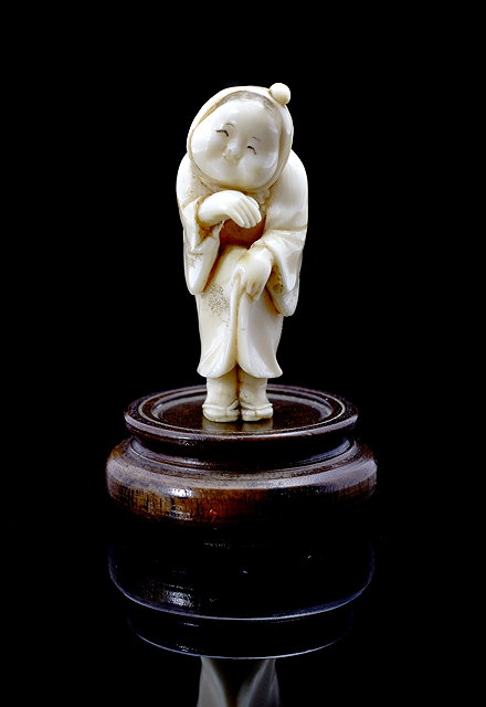 Appraisal: A Japanese ivory netsukeMeiji period - modelled as a standing