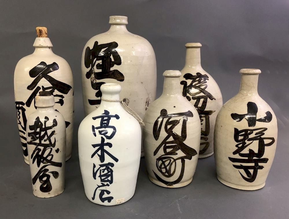 Appraisal: Seven Pottery Sake Bottles Seven pottery sake bottles Meiji period