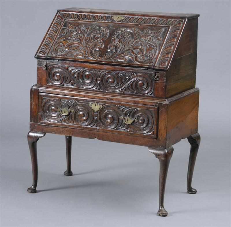 Appraisal: ENGLISH PROVINCIAL CARVED AND STAINED OAK SLANT-FRONT DESK The foliate