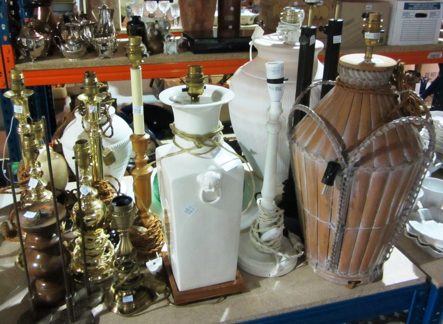 Appraisal: A large quantity of th century table lamps wooden brass