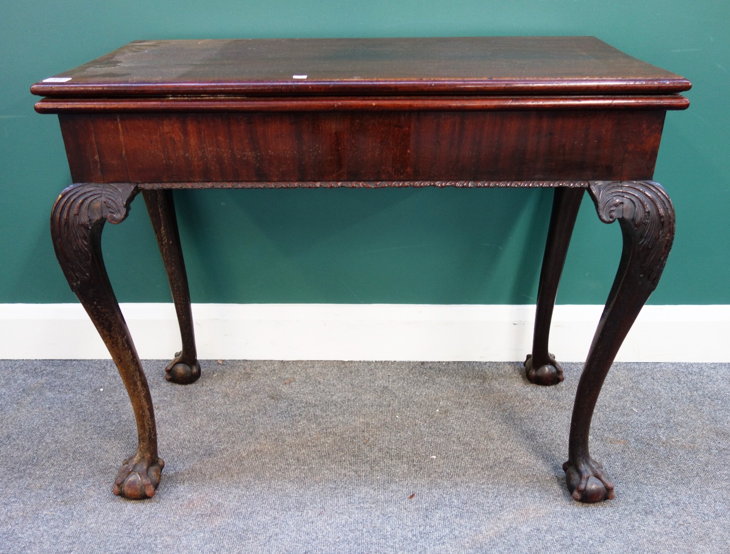 Appraisal: A George III rectangular mahogany card table on claw and