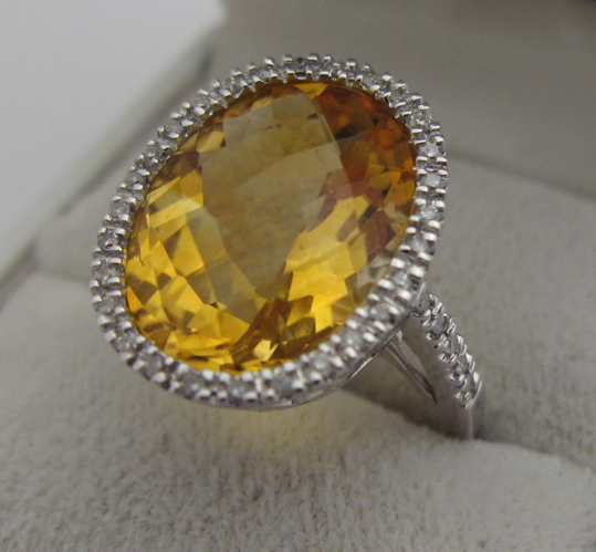 Appraisal: CITRINE DIAMOND AND KARAT WHITE GOLD RING set with an