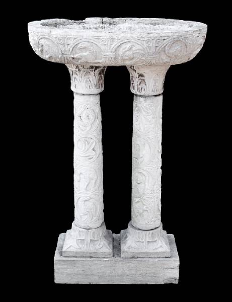 Appraisal: An Italian carved limestone birdbath th century The oval plateau