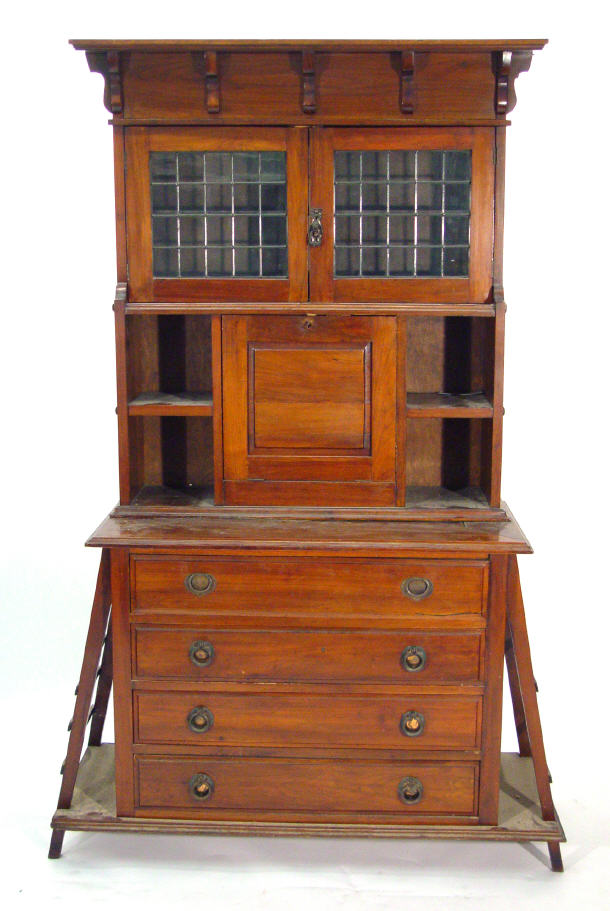 Appraisal: Victorian walnut aesthetic style bookcase fitted a pair of leaded