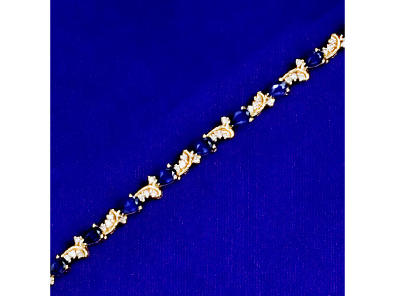 Appraisal: SAPPHIRE AND DIAMOND BRACELET k yellow gold line bracelet set