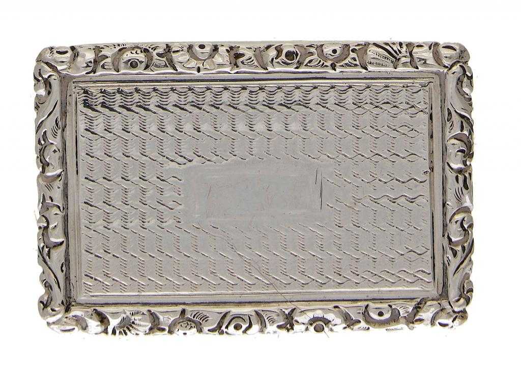 Appraisal: A GEORGE IV SILVER VINAIGRETTE engine turned with chased border