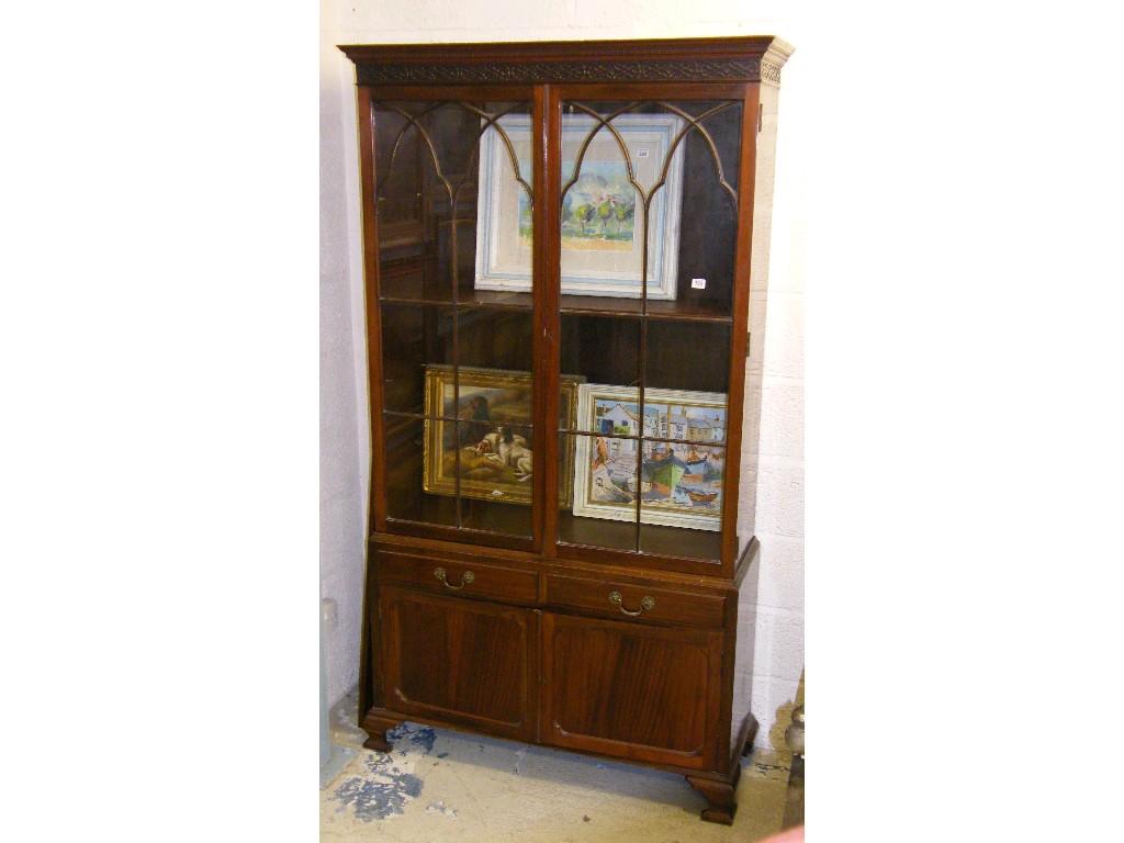 Appraisal: Georgian style mahogany glazed bookcase the carved dentil and blind