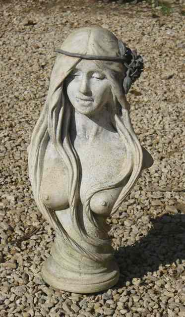 Appraisal: A COMPOSITE BUST OF A MAIDEN with long flowing hair