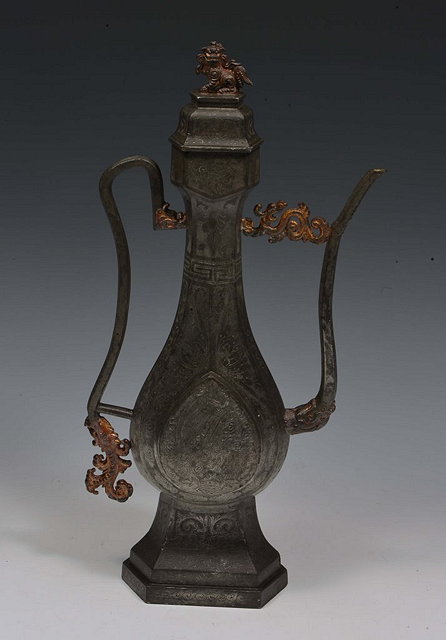 Appraisal: A CHINESE PEWTER PERSIAN MARKET EWER finely engraved to its