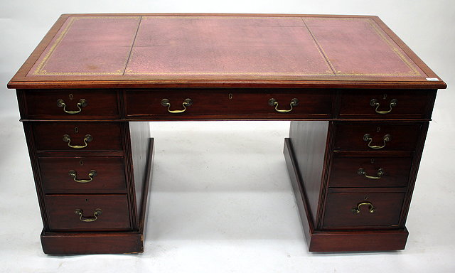 Appraisal: AN EDWARDIAN MAHOGANY PEDESTAL DESK with pale burgundy leather inset