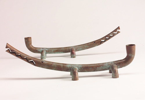 Appraisal: JONATHAN BONNER Pair of whimsical alligator-shaped candlesticks of patinated copper