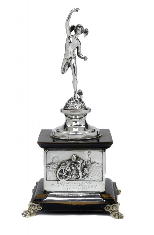 Appraisal: THE DUNLOP TROPHY A SILVER FIGURAL TROPHY IN THE FORM