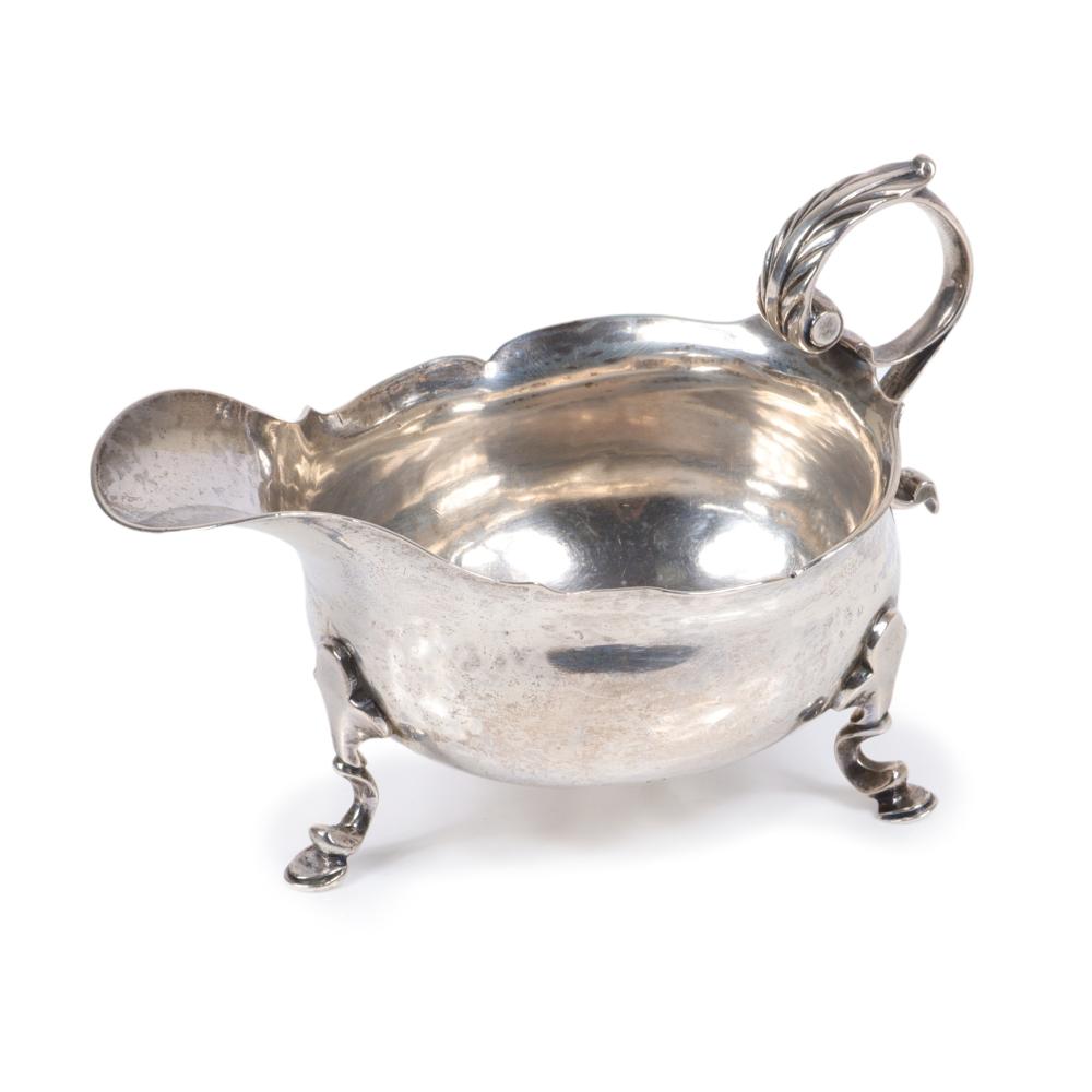 Appraisal: ENGLISH GEORGE II OVAL STERLING SILVER SAUCE BOAT ON THREE