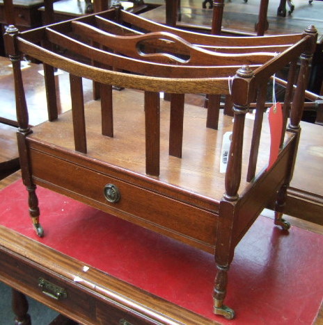 Appraisal: An early th century style mahogany canterbury with a concave