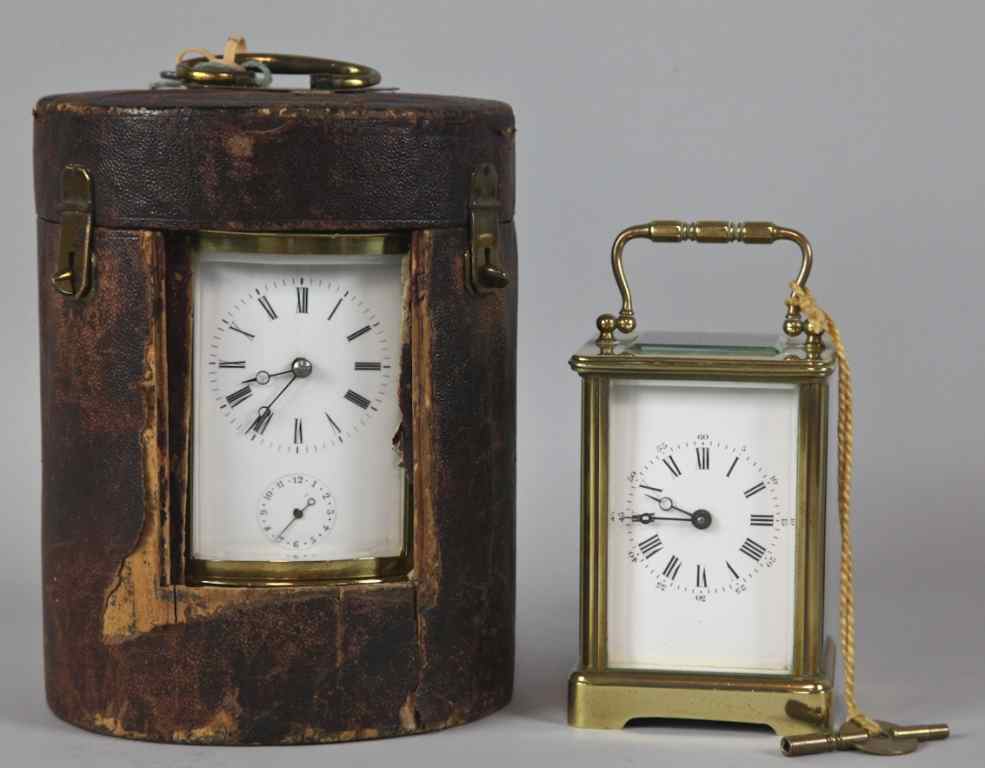 Appraisal: TWO CARRIAGE CLOCKS The larger of oval cylindrical form with