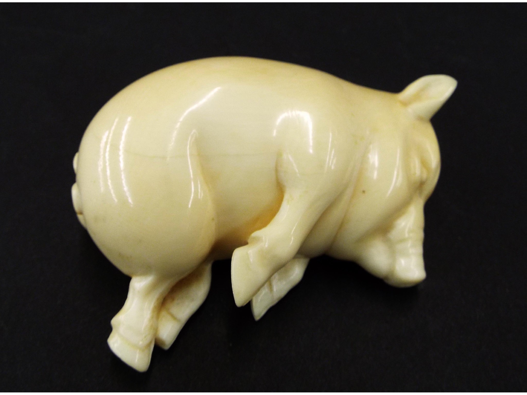 Appraisal: Attractive early th century ivory carving of a sleeping pig