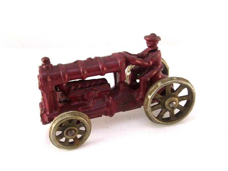 Appraisal: Cast Iron Tractor Original red paint No mark measures high