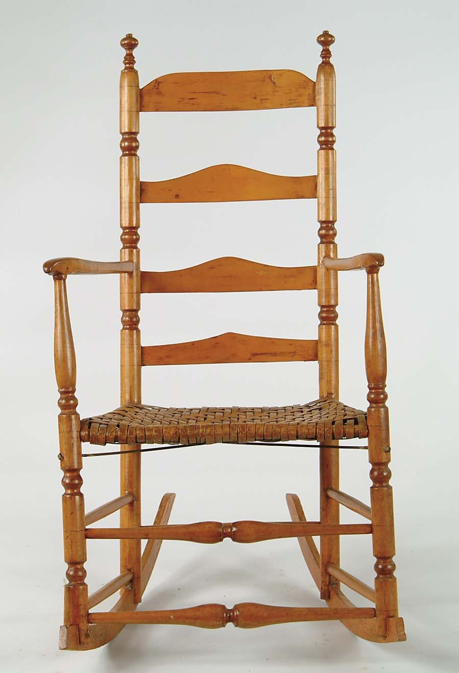 Appraisal: EARLY LADDERBACK ARMED ROCKER Turned back posts supporting four shaped