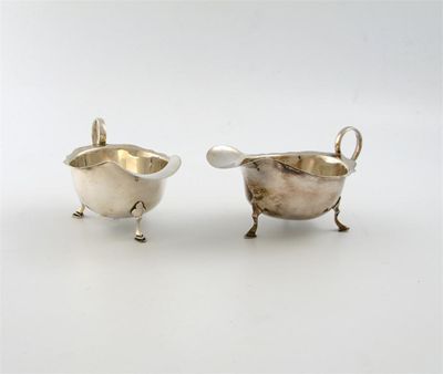 Appraisal: A pair of silver sauce boats by A and J