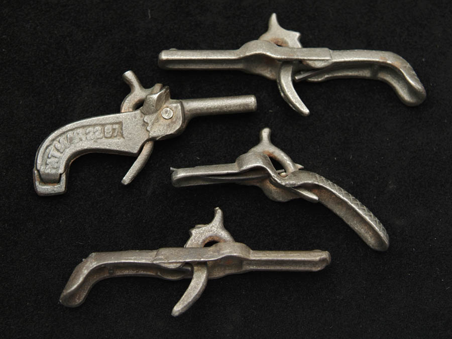 Appraisal: LOT OF FOUR CAST IRON CAP GUNS Includes three penny