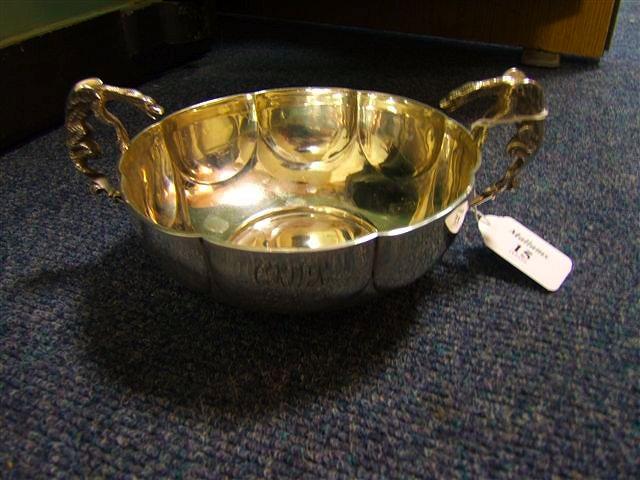 Appraisal: An Edwardian lobed silver dish with cast dragon handles marks