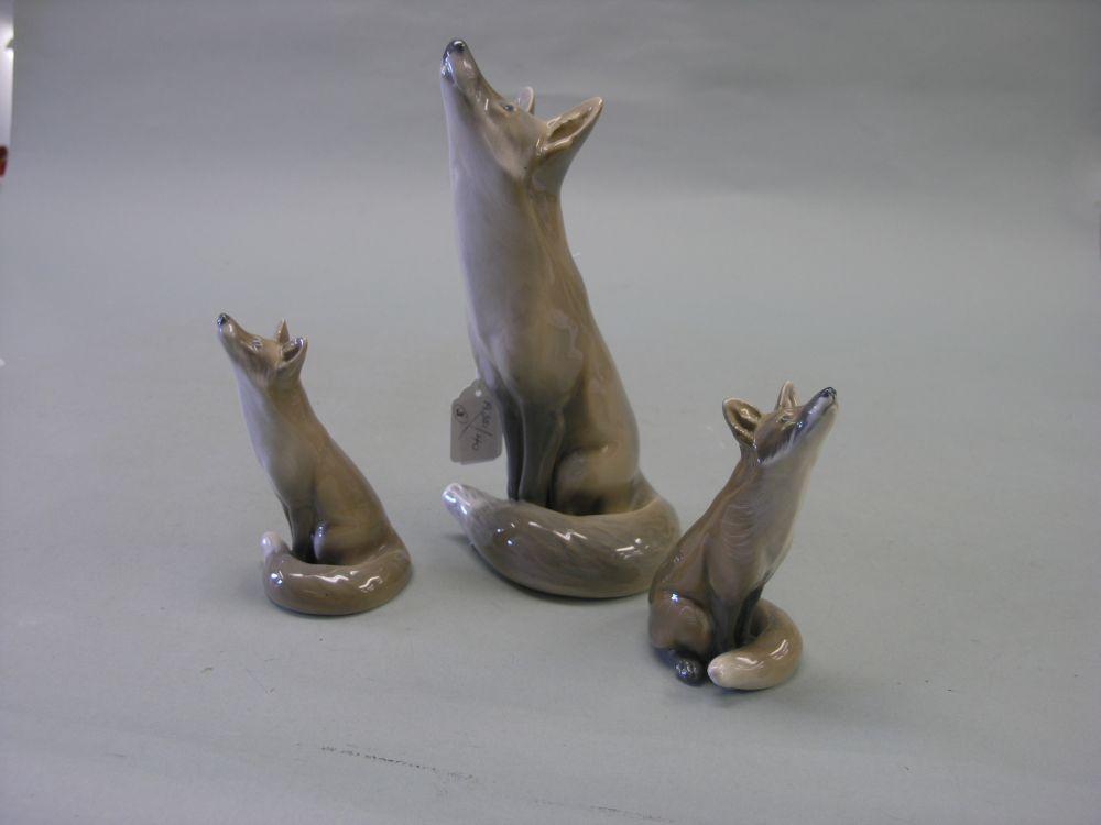 Appraisal: Three Royal Copenhagen fox models each seated peering upward largest