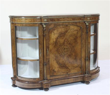 Appraisal: A Victorian brass and inlaid walnut credenza the moulded top