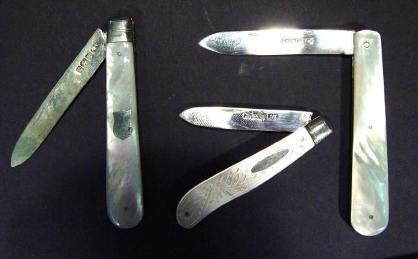 Appraisal: Three mother of pearl handled silver fruit knives Sheffield