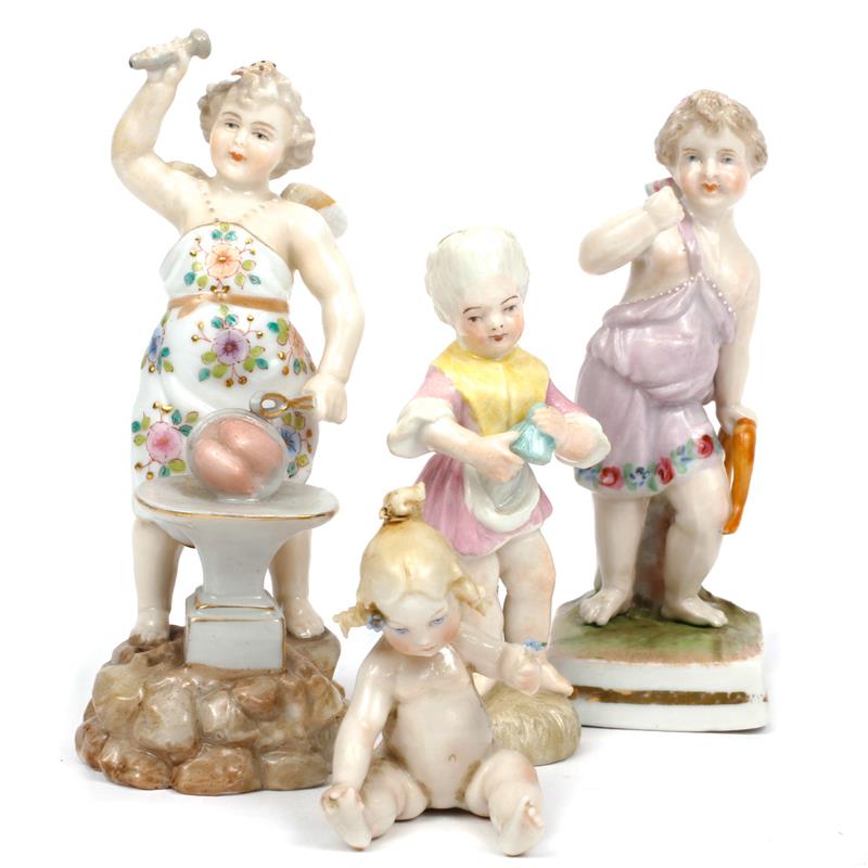 Appraisal: Group of four German porcelain children figures Girl figure has