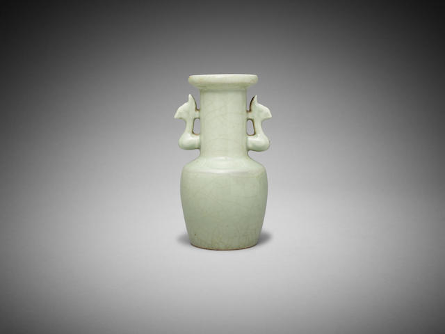 Appraisal: A Chinese celadon-glaze mallet-shaped vase with 'phoenix' handles cm high