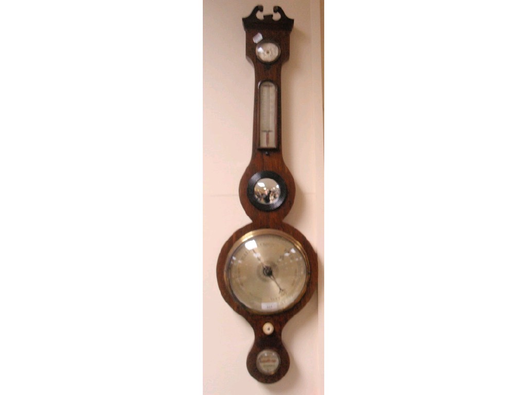 Appraisal: A thC oak wheel barometer with hydrometer thermometer over a