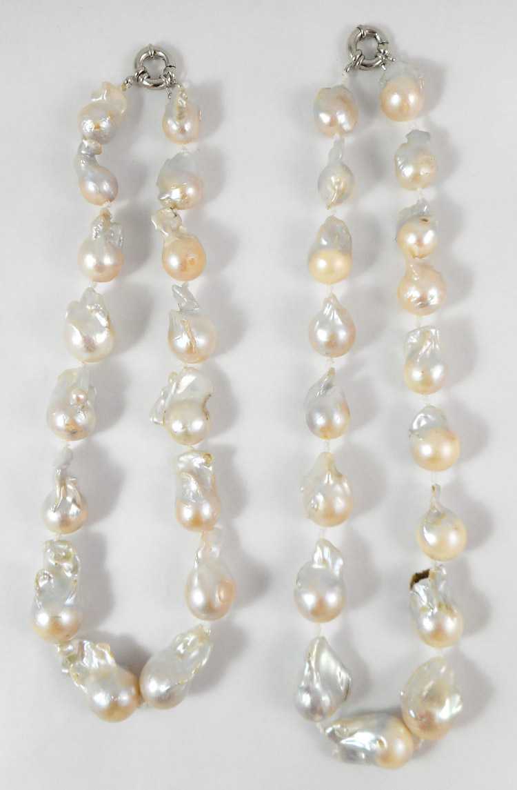 Appraisal: TWO PRINCESS LENGTH WHITE BAROQUE PEARL NECKLACES measuring inches in