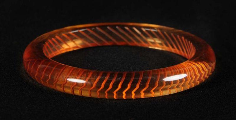 Appraisal: Bakelite Reverse Carved Geometric Bracelet Condition Near Mint Size T