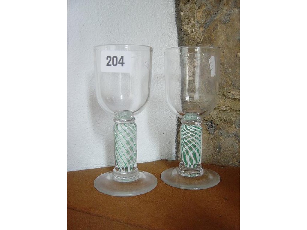 Appraisal: A pair of drinking glasses with thick opaque air twist