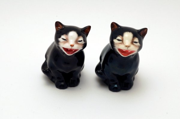 Appraisal: Two Royal Doulton Lucky cat figurines both marked in green