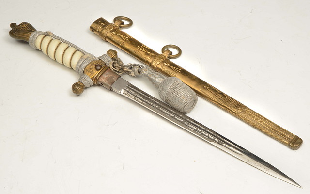 Appraisal: A GERMAN NAZI NAVAL OFFICERS DAGGER with engraved blade and