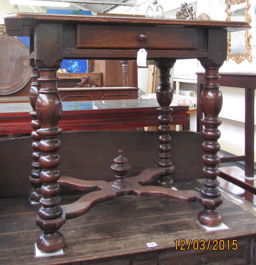 Appraisal: A th century style oak single drawer side table on