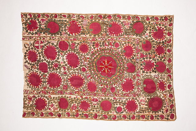 Appraisal: AN UZBEK SUZANI PANEL with pomegranate and green foliage motif